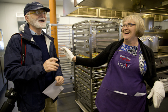 Photographer Tim Kennedy and Trinity Cafe Program Director Cindy Davis share a laugh. 