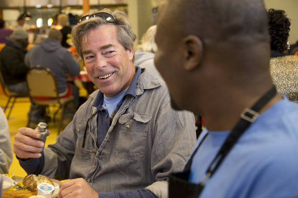 James Nickoles chats with Trinity Cafe volunteer George Tawe during lunch service. Nickoles recently