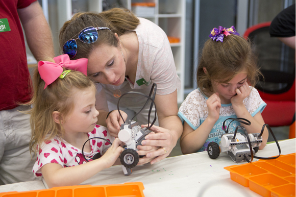 Regan and Grace Moye participate in Make-A-Bot at MOSI. 