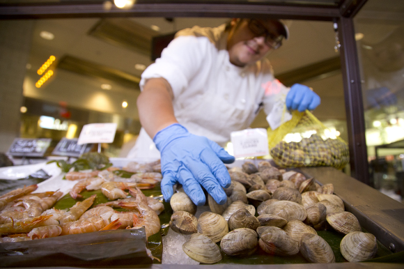 The clams are then moved to the seafood display case. 