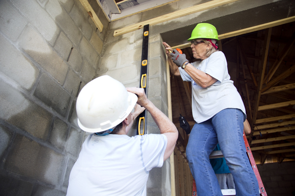 Donna Harding, volunteer from St Michaels The Archangel Catholic Church, works on the Acevedo family home. 