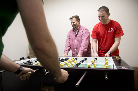 Jack Kenney and Brett Lee have a foosball break at kitedesk.