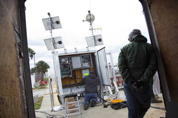 A team from NOAA installs a water level meteorological station in St Pete.