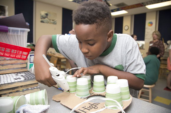 Derenz Thomas, 10, creates a guitar sculpture during Amanda Fleischbein's art class at Academy Prep Center of Tampa.