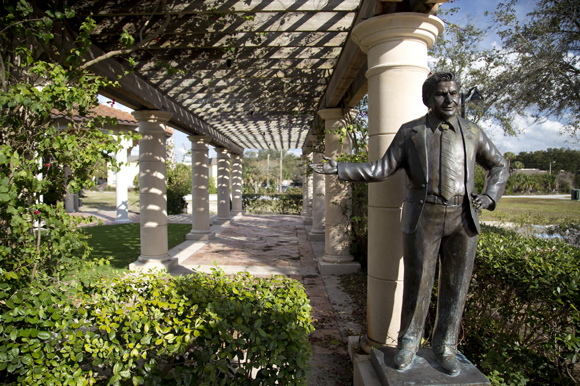 Statue of Mayor Joe Affronti with a plaque of te city's Master Developer's Agreement. 