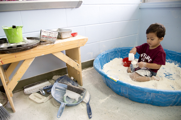 Blake, 2, plays with flour at The Wonder Studio in St Pete. 