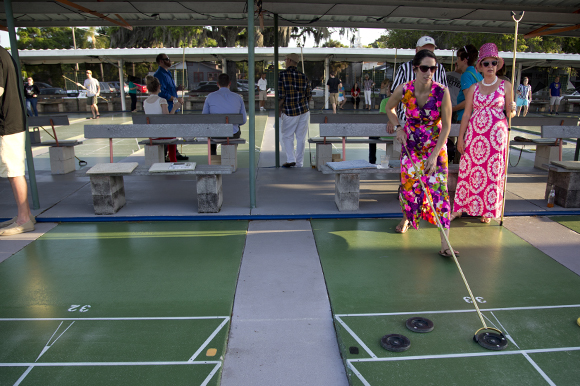 Carrie Whaley and Valerie Goff get in the shuffleboard spirit at Realize Bradenton's PopUps for a Purpose event. 