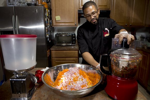 John Richardson prepares his Jon's Gourmet Products Jerk Smoked Turkey Spread.