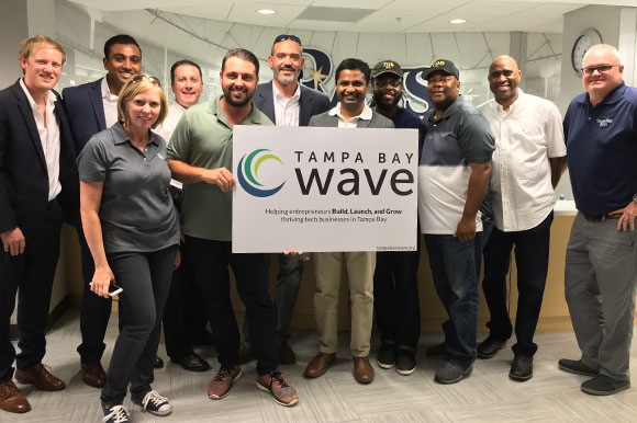 Startup founders and judges pose for pix after pitches