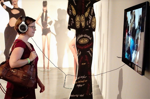 Fourth Fridays attendees scroll through the Tampa Museum of Arts exhibits.