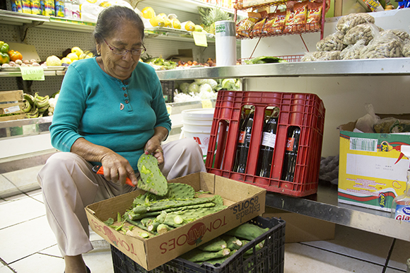 Reyna Rocha prepares cactus leaves for cooking. 