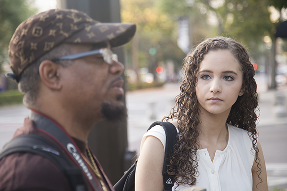 Sara Al-Mutawa talks with Tim Cameron while filming Art In The City. 