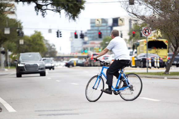 A cyclist crosses Westshore Blvd. 