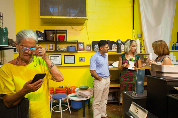 Paola Nesmith, left, visits art studios during the Second Saturday Art Walk at the new Arts XChange.