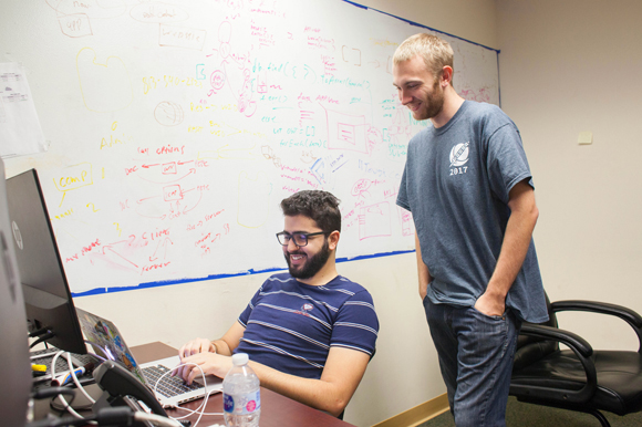 Fadi Bitar, left, and Caelen Burke create apps at Leapdoctor Locums. 