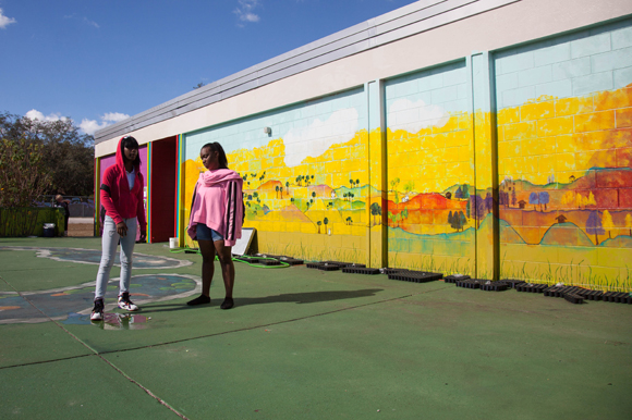 Pete Lawson's Americana mural adds vibrancy to a formerly beige colored courtyard.