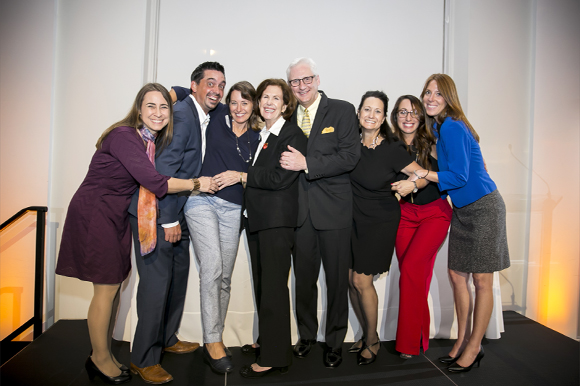 Christine Burdick, center, wins Person of the Year award.