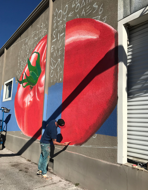 IVES, an Amsterdam based street artist, paints in Ybor. 