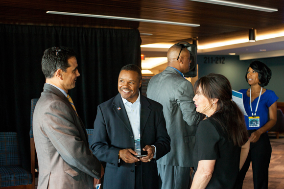 Speakers mingle before the Growing an Inclusive Innovation Ecosystem in Florida breakout session.