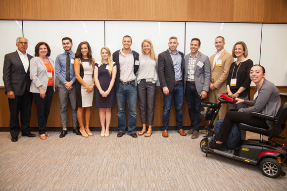 New Venture Expo student category first, second, and third place winners stand with event sponsors.