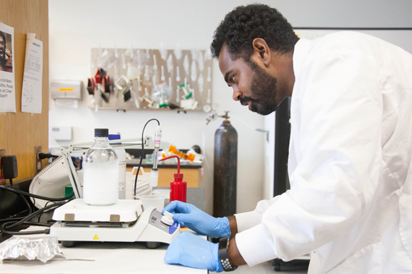 Justin Nichols, a student at USF, collects protein for malaria vaccination studies. 