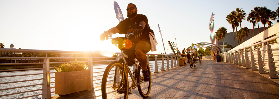 A cyclist cruises down the Riverwalk at Curtis Hixon Park in downtown Tampa.