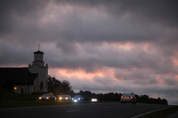 Cars pass by a Lecanto church the night before Hurricane Matthew made landfall in Florida in 2016.