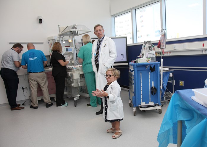 Dr., Paul Danielson, chief, div., of pediatric surgery, and Dr., Jennifer Arnold, medical director of the Simulation Center talk to media during the grand opening.