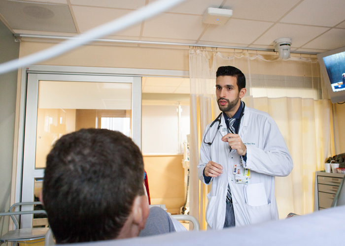 Jesus Diaz Vera talks with a patient in ICU who underwent cardiac surgery, and informs him that they've ruled out any fungal infection in the heart.