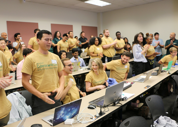 Students show their specialty T-shirts Friday on their first of class.