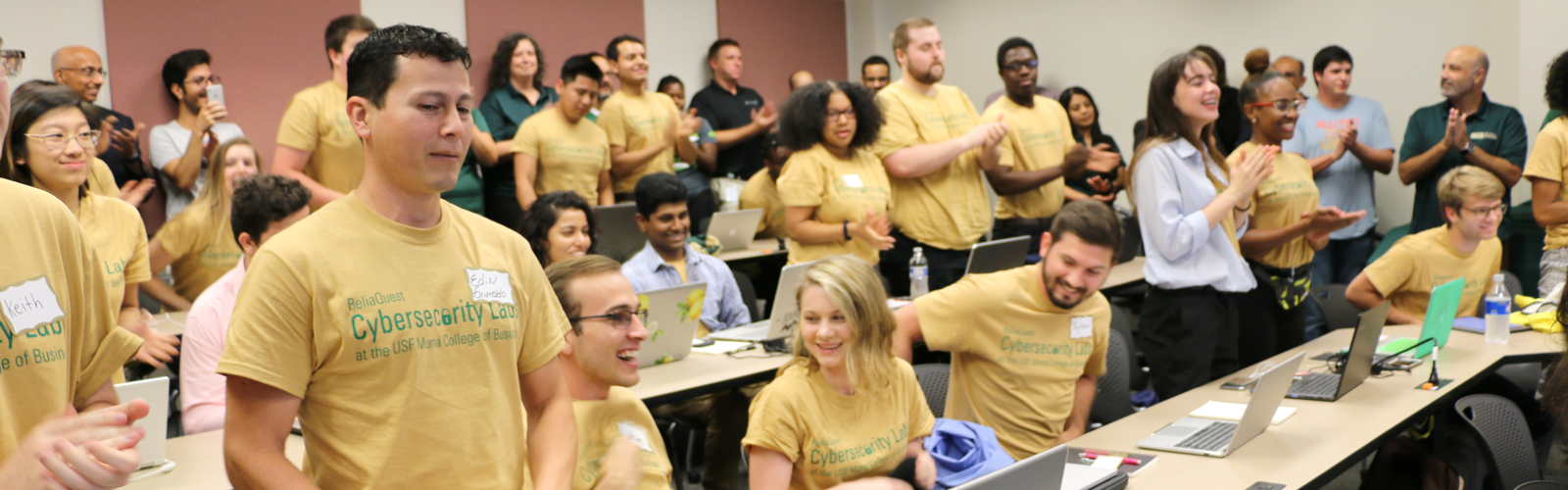 Students show their specialty T-shirts Friday on their first of class.
