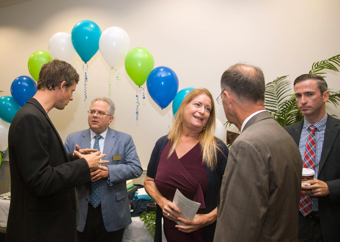 (L-R) David McDougal, Tampa City Councilman Harry Cohen, Susan Glickman, and Ian Whitney with the City of Tampa mingle at the event.
