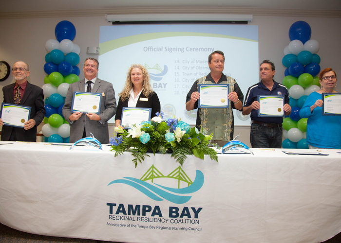 City officials from Clearwater, Dunedin, Gulfport, Indian Rocks Beach, Largo, and Indian Shores sign the official documents to create a more resilient area in the face of climate change.