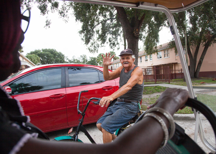 Reva Iman waves hello to Papi whose family lives at Robles Park Village.