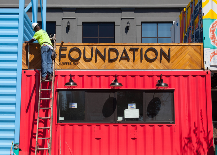 Foundation Coffee housed inside a storage pod gets finishing touches at Sparkman Wharf.