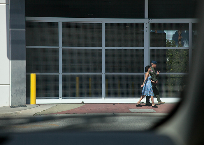 A couple walks along Channelside Drive.