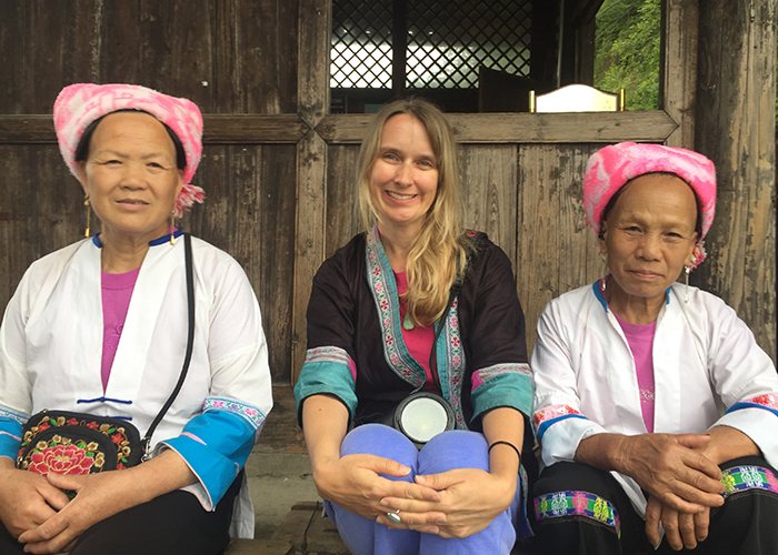 Amber Sigman with the Zhuang people of Longsheng's rice terraces in China.