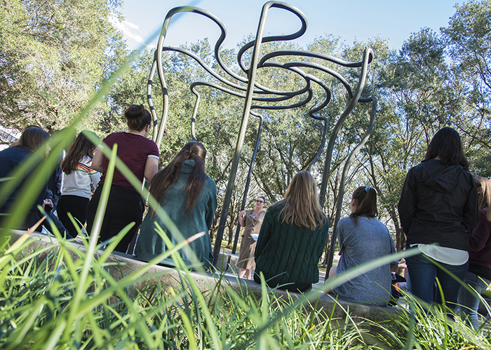 Solar Rotary, a work of art by Nancy Holt, attracts a crowd.