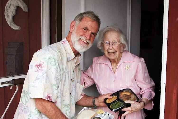 Volunteers deliver hot meals three days a week to people in need.