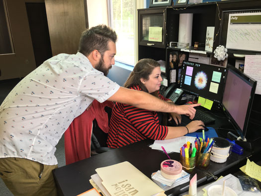 Bryant Salyers and Faye Gross review an incoming order.