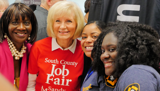 Sandy Murman, second from left, organizes job fairs to get people back to work.