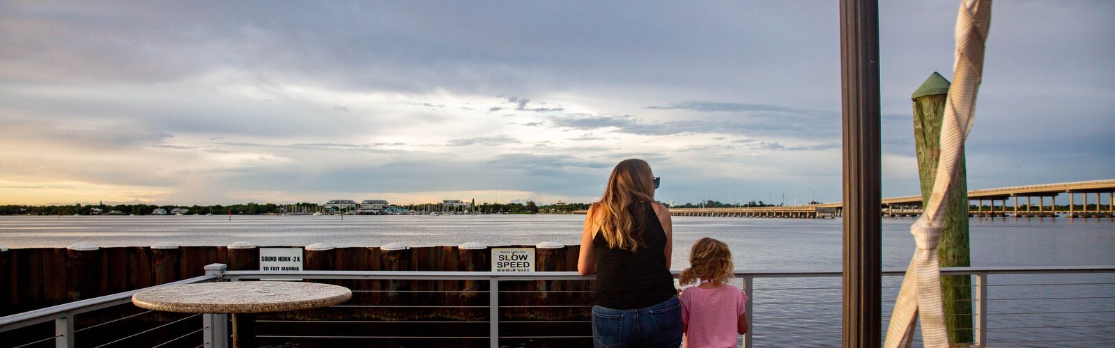 Kristen Miller and her daughter Olivia look out over the Manatee River in downtown Bradenton.