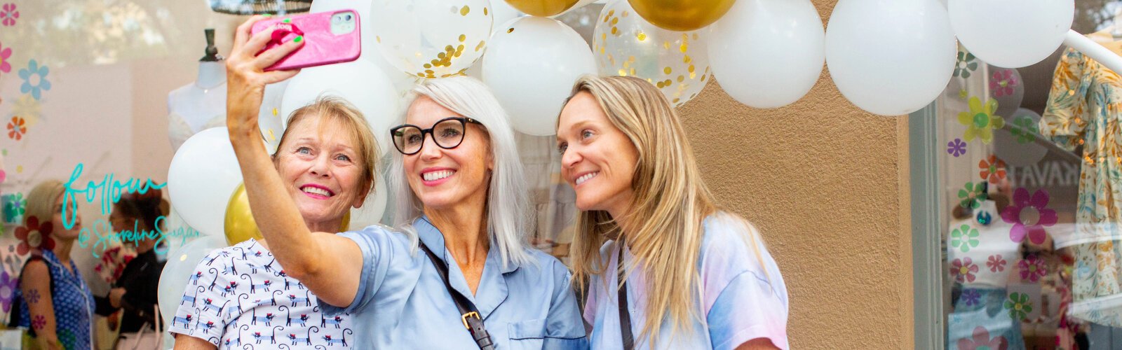 Guests get photos in their pajamas at 7:25 am during the 48th annual Sunrise Sale shopping spree where local businesses offer rare sale opportunities starting at sunrise in downtown St. Pete. 