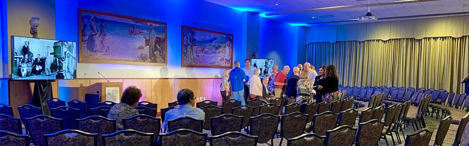 Attendees at a Florida Conversation with Richard Gonzmart (his ancestors include the Gonzalez and Martinez families) mingle afterward for a few personal questions. 