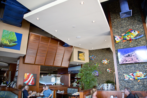 Paintings by B.C. Woo and metal art by Clayton Swartz adorn the walls at 400 Beach Seafood & Tap House.