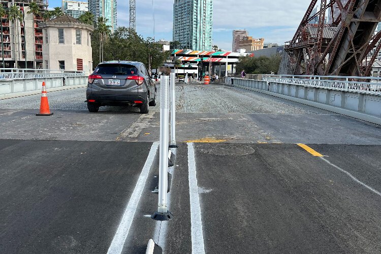 The City of Tampa has installed barriers along the Cass Street Bridge to separate vehicle and bicycle lanes.