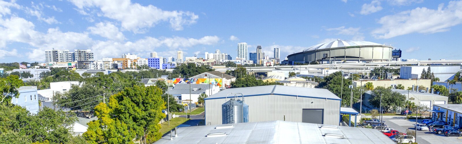 The view of downtown St. Petersburg and Tropicana Field from 3 Daughters Brewing,