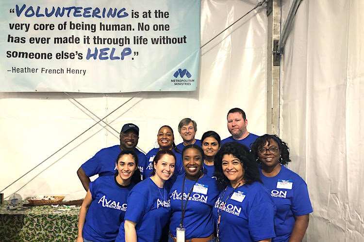 Avalon volunteers at the Metropolitan Ministries annual holiday Hope tent in 2019.