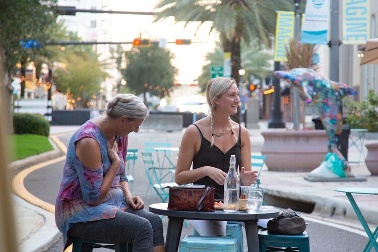 Elizabeth McLuskey and her mom Patti play during Juno Vibranz’s Drag Bingo night outside of Pour Yours Wine Bar in downtown Clearwater. 