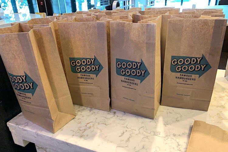 Bags full of food supplies for furloughed employees at Goody Goody Burgers.